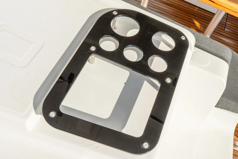 Dakiti Yacht Photos Pics Control panel on 2023 Lagoon 46 yacht, featuring multiple circular cutouts.