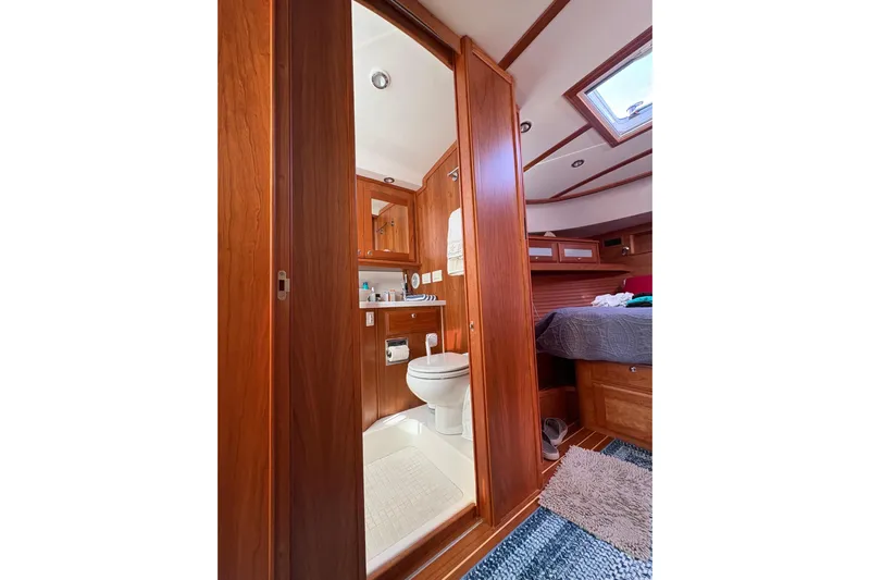  Yacht Photos Pics Luxurious interior of 2023 Sabre 45 Salon Express yacht, featuring elegant wood finishes and modern amenities.