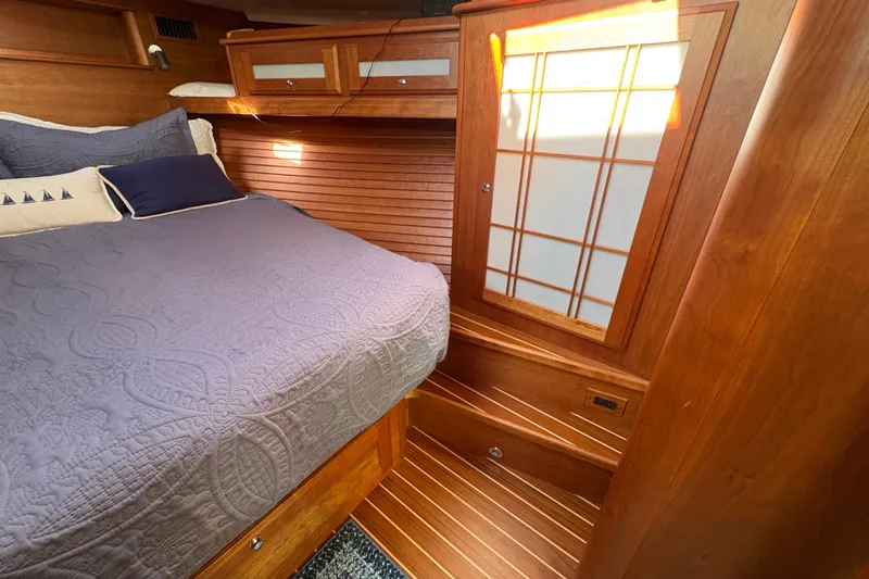  Yacht Photos Pics Luxurious cabin interior of 2023 Sabre 45 Salon Express yacht with wooden finishes.