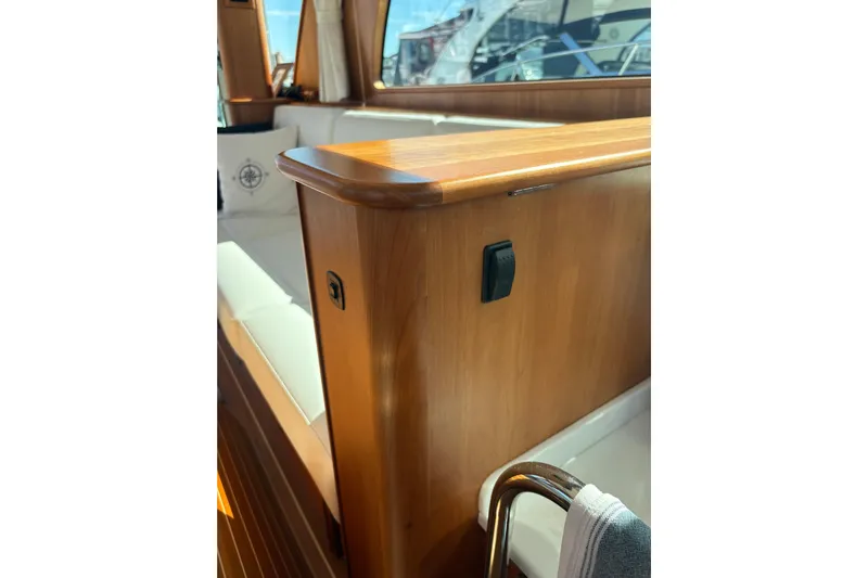  Yacht Photos Pics Interior of 2023 Sabre 45 Salon Express, featuring elegant wood finish and comfortable seating.