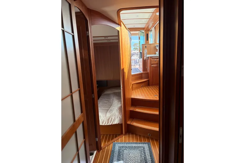  Yacht Photos Pics Interior of 2023 Sabre 45 Salon Express yacht, featuring wooden finishes and cozy cabin.