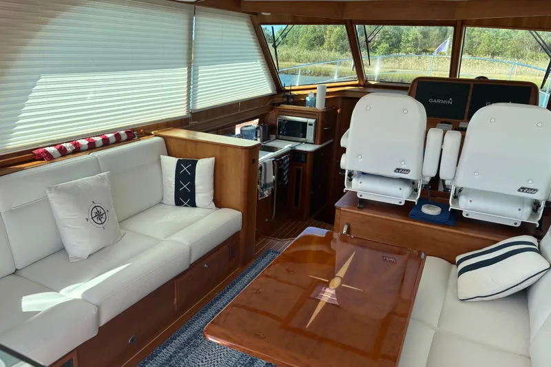  Yacht Photos Pics Luxurious interior of 2023 Sabre 45 Salon Express yacht with plush seating and modern amenities.
