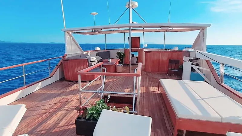 Korab Yacht Photos Pics Luxurious deck of 2001 Custom Motor Yacht Korab, featuring seating and ocean views.