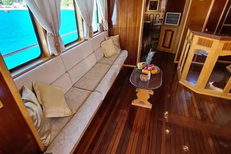 Korab Yacht Photos Pics Luxurious interior of 2001 Custom Motor Yacht Korab with elegant seating and fruit display.