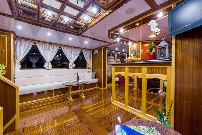 Korab Yacht Photos Pics Luxurious interior of 2001 Custom Motor Yacht Korab with elegant wood finishes and cozy seating.