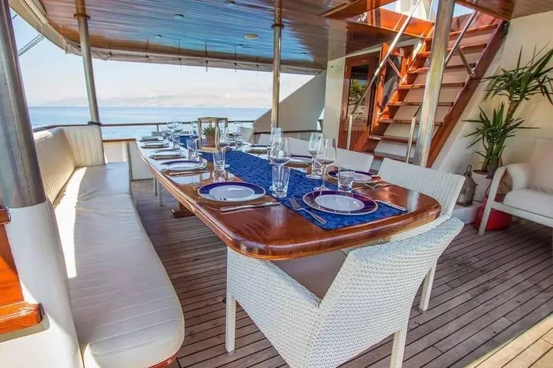 Korab Yacht Photos Pics Luxurious dining area on the 2001 Custom Motor Yacht Korab, featuring elegant table settings.