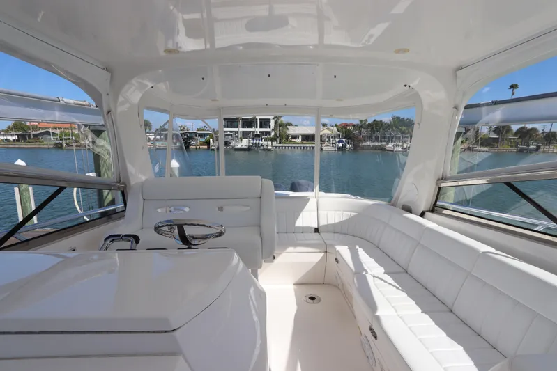 Relentless Yacht Photos Pics Luxurious interior of 2012 Intrepid 430 Sport Yacht with white seating and waterfront view.