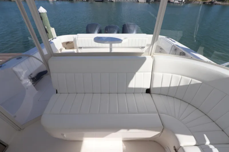 Relentless Yacht Photos Pics 2012 Intrepid 430 Sport Yacht interior with white seating and ocean view.