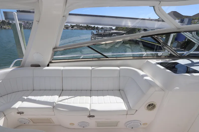 Relentless Yacht Photos Pics Luxurious white seating on 2012 Intrepid 430 Sport Yacht, overlooking marina view.
