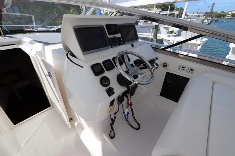 Relentless Yacht Photos Pics Cockpit of 2012 Intrepid 430 Sport Yacht with steering wheel and navigation screens.