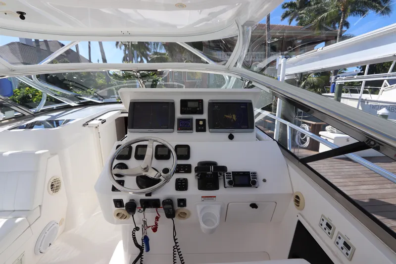 Relentless Yacht Photos Pics Cockpit of 2012 Intrepid 430 Sport Yacht with steering wheel and navigation controls.
