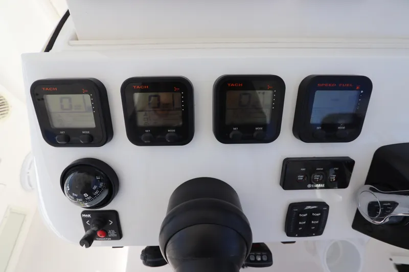 Relentless Yacht Photos Pics Control panel of a 2012 Intrepid 430 Sport Yacht with tachometers and navigation instruments.