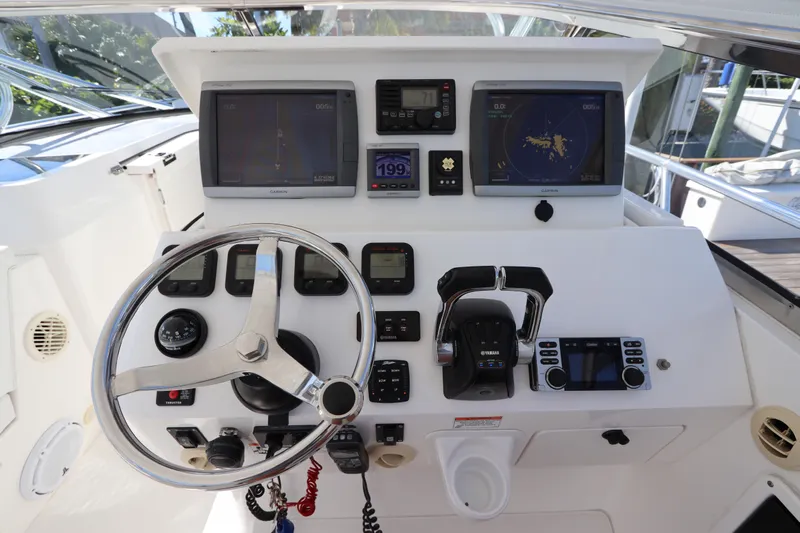 Relentless Yacht Photos Pics Helm of 2012 Intrepid 430 Sport Yacht with navigation screens and controls.