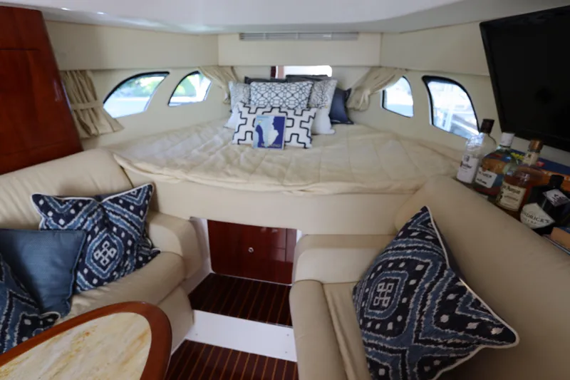 Relentless Yacht Photos Pics Luxurious interior of 2012 Intrepid 430 Sport Yacht with cozy seating and stylish decor.