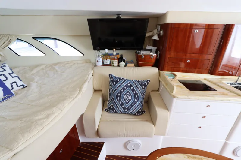 Relentless Yacht Photos Pics Luxurious interior of 2012 Intrepid 430 Sport Yacht with cozy seating and elegant decor.