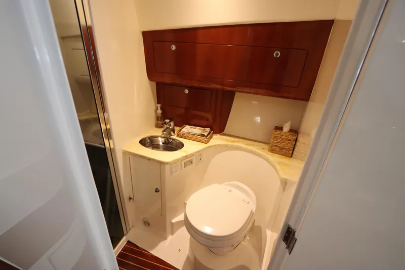 Relentless Yacht Photos Pics Luxurious bathroom in 2012 Intrepid 430 Sport Yacht with wood accents and modern fixtures.