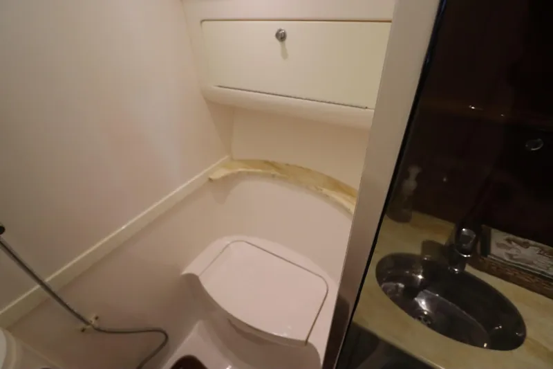 Relentless Yacht Photos Pics Bathroom interior of 2012 Intrepid 430 Sport Yacht with toilet and sink.