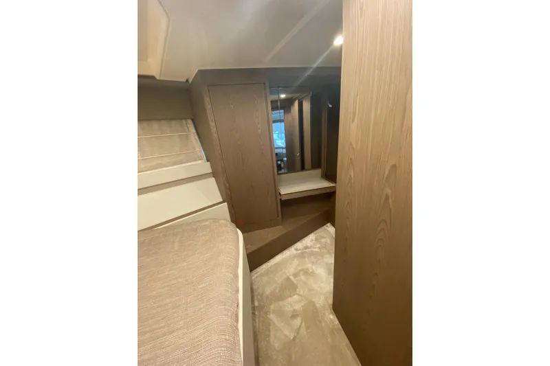  Yacht Photos Pics Interior of 2017 Ferretti Yachts 550, featuring modern wood paneling and cozy design.