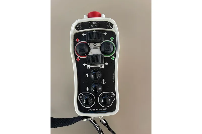  Yacht Photos Pics Remote control for 2017 Ferretti Yachts 550, featuring various navigation buttons and controls.