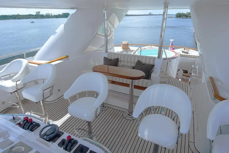 Mystique Yacht Photos Pics Luxurious 2001 Feadship Custom yacht deck with seating, controls, and ocean view.