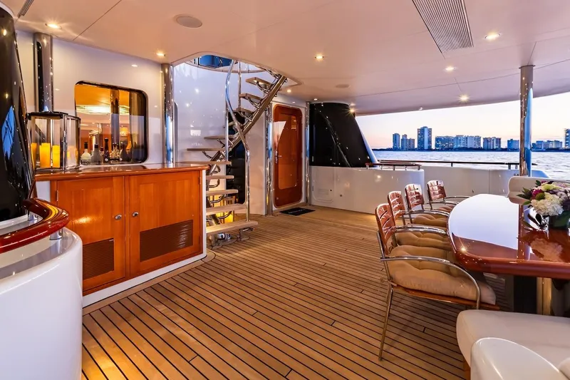 Mystique Yacht Photos Pics Luxurious 2001 Feadship Custom yacht interior with elegant dining area and scenic ocean view.