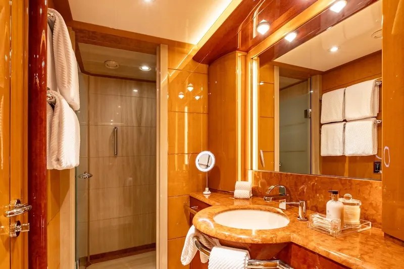 Mystique Yacht Photos Pics Luxurious yacht bathroom with marble sink, elegant lighting, and modern shower. Feadship Custom 2001.