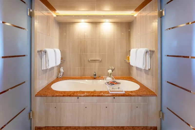 Mystique Yacht Photos Pics Luxurious yacht bathroom with elegant bathtub, Feadship Custom 2001 model.
