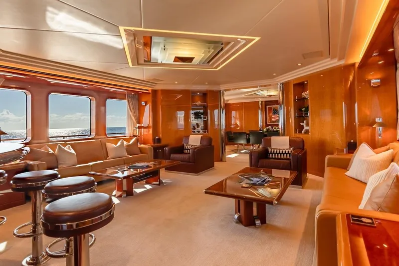 Mystique Yacht Photos Pics Luxurious interior of 2001 Feadship Custom yacht with elegant seating and ocean views.