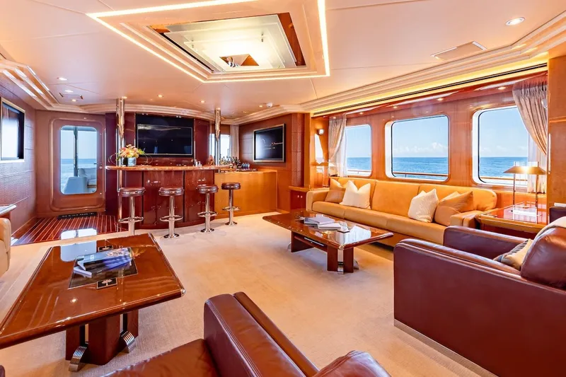 Mystique Yacht Photos Pics Luxurious 2001 Feadship Custom yacht interior with elegant seating, bar, and ocean views.