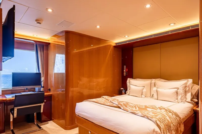 Mystique Yacht Photos Pics Luxurious bedroom interior on 2001 Feadship Custom yacht with ocean view and modern amenities.