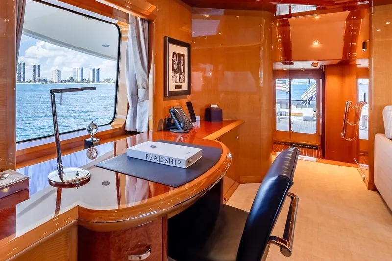 Mystique Yacht Photos Pics Luxurious Feadship Custom yacht interior, 2001 model, featuring elegant wood finishes and ocean view.