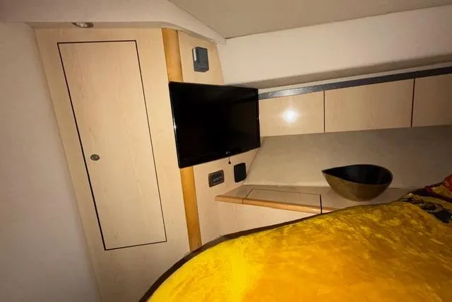 Big Energy Yacht Photos Pics Interior of 2004 Sea Ray 420 Sedan Bridge with TV and modern cabinetry.