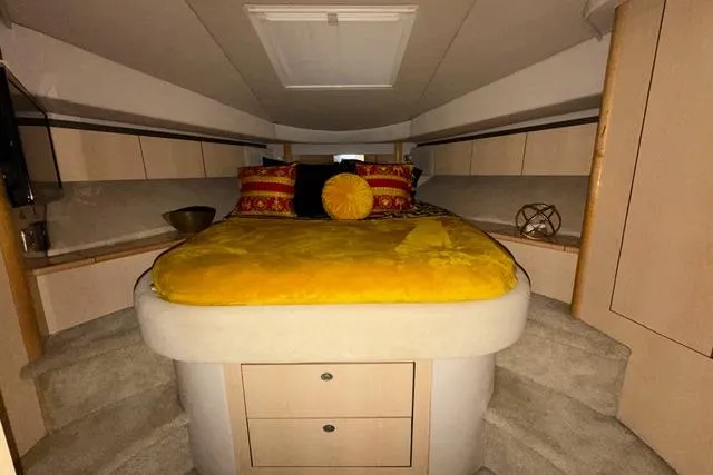 Big Energy Yacht Photos Pics Luxurious cabin interior of 2004 Sea Ray 420 Sedan Bridge yacht with vibrant bedding.