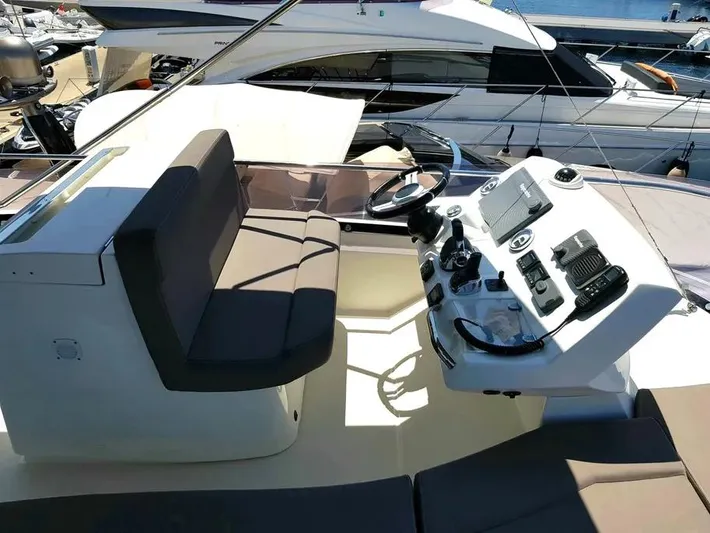  Yacht Photos Pics Helm of 2013 Prestige 500 yacht with modern controls and seating.