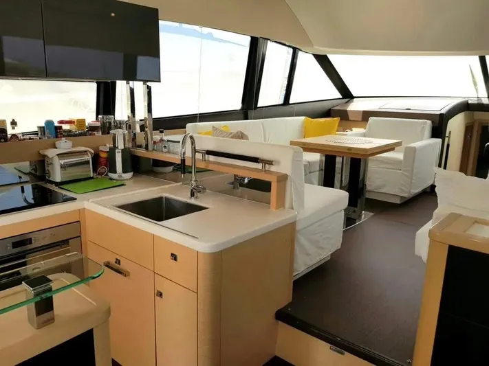  Yacht Photos Pics Luxurious interior of a 2013 Prestige 500 yacht with modern kitchen and seating area.