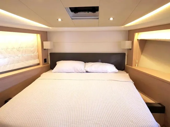  Yacht Photos Pics Luxurious bedroom interior of 2013 Prestige 500 yacht with modern lighting and cozy bedding.