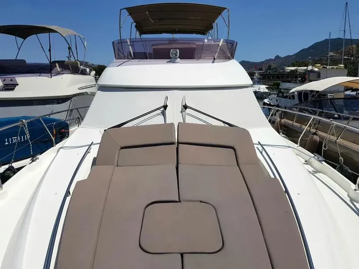  Yacht Photos Pics Luxury 2013 Prestige 500 yacht with spacious sun deck in marina setting.