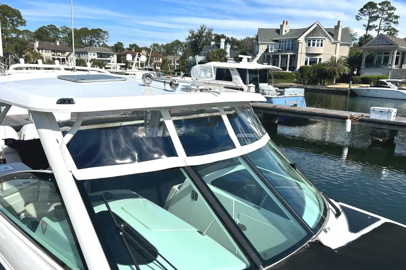  Yacht Photos Pics 2017 Boston Whaler 320 Vantage docked near waterfront homes.