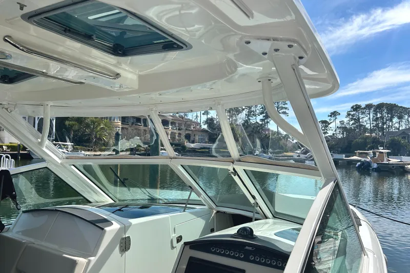  Yacht Photos Pics 2017 Boston Whaler 320 Vantage boat interior with scenic waterfront view.