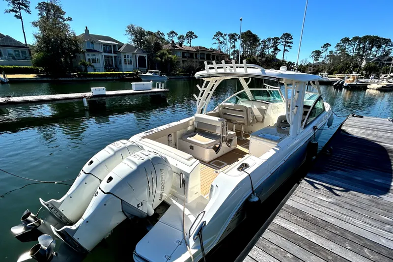  Yacht Photos Pics 2017 Boston Whaler 320 Vantage docked in a scenic marina setting.