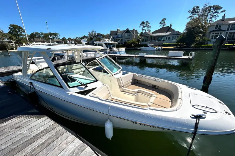 Yacht Photos Pics 2017 Boston Whaler 320 Vantage docked in a scenic marina setting.