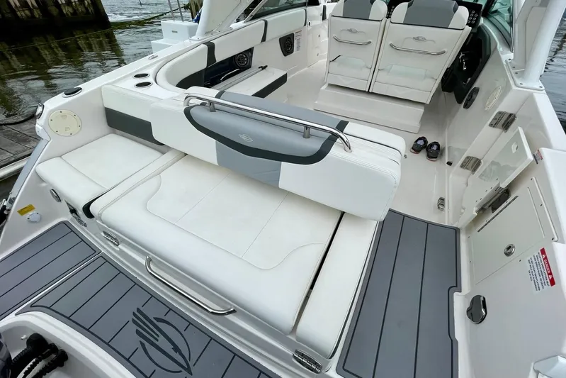 Seaventure Yacht Photos Pics 2023 Chaparral 280 OSX boat interior with white seating and sleek design.