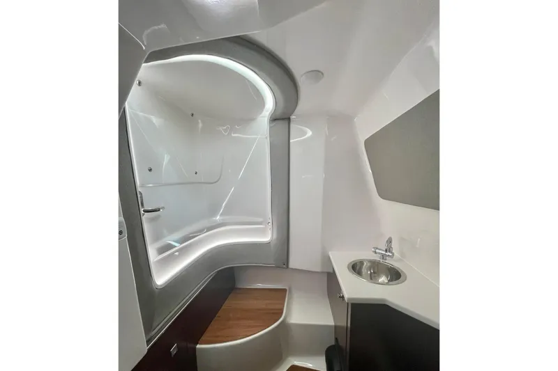 Seaventure Yacht Photos Pics 2023 Chaparral 280 OSX boat interior with modern bathroom and sleek design.