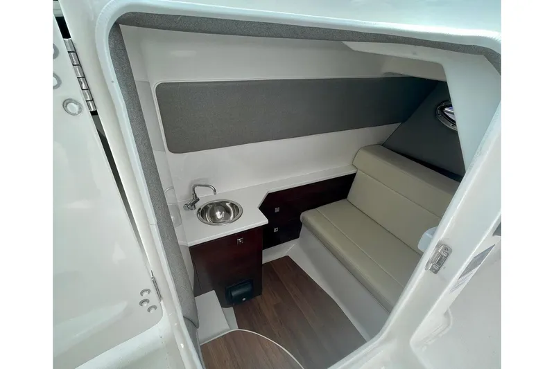 Seaventure Yacht Photos Pics 2023 Chaparral 280 OSX cabin interior with seating and sink.