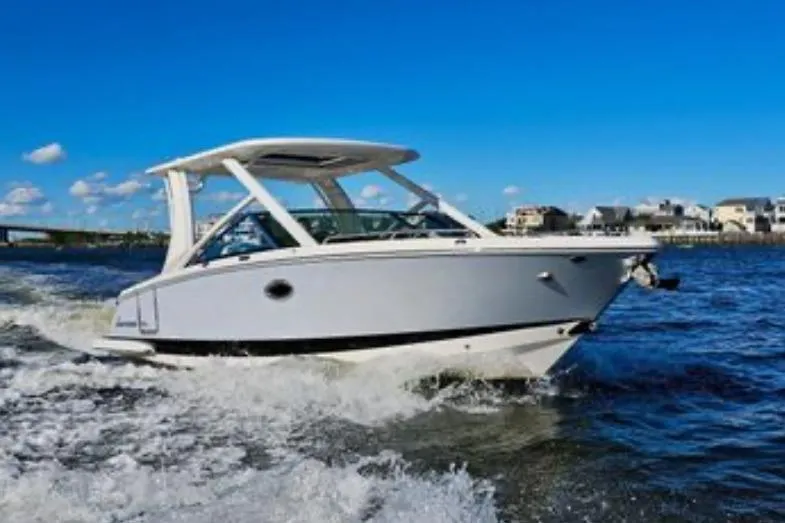 Seaventure Yacht Photos Pics 2023 Chaparral 280 OSX boat cruising on a sunny day with clear blue skies.