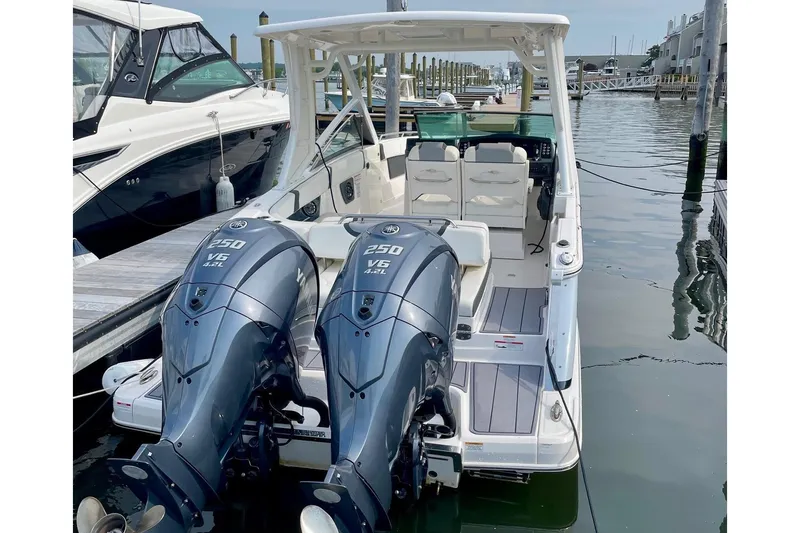 Seaventure Yacht Photos Pics 2023 Chaparral 280 OSX boat with dual 250 V6 engines docked at marina.
