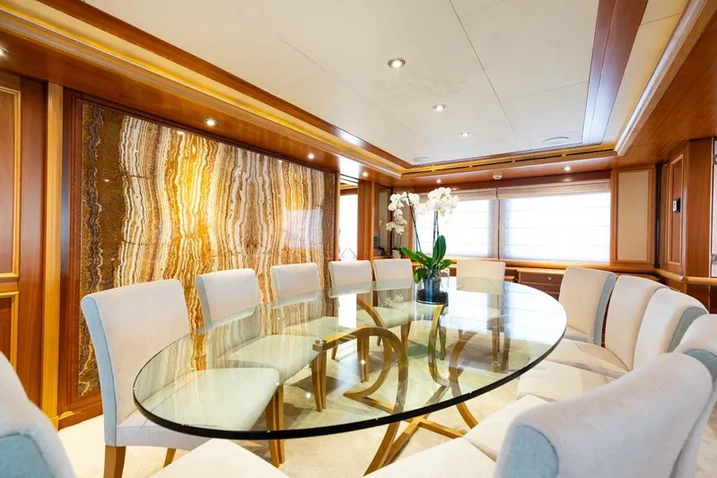 Emotion 2 Yacht Photos Pics Luxurious dining area on 2007 CRN Motor Yacht with elegant decor and glass table.