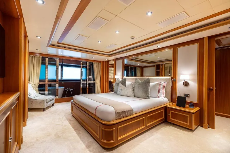 Emotion 2 Yacht Photos Pics Luxurious 2007 CRN Motor Yacht bedroom with elegant wood finishes and plush bedding.