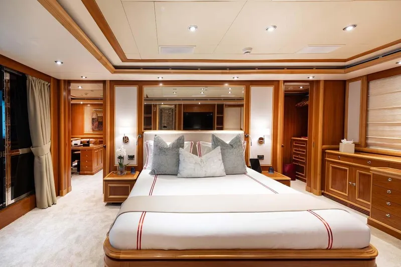 Emotion 2 Yacht Photos Pics Luxurious 2007 CRN Motor Yacht bedroom with elegant wood finishes and modern decor.