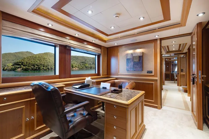 Emotion 2 Yacht Photos Pics Luxurious 2007 CRN Motor Yacht office with elegant wood paneling and scenic window views.